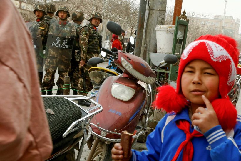 Security personnel keep watch in a street in Kashgar, Xinjiang (East Turkistan) Uighur Autonomous Region, China, March 23, 2017.