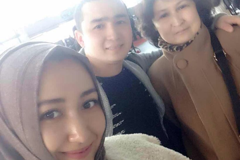 Mr Nizamidin with his wife and mother who are both now under detention.